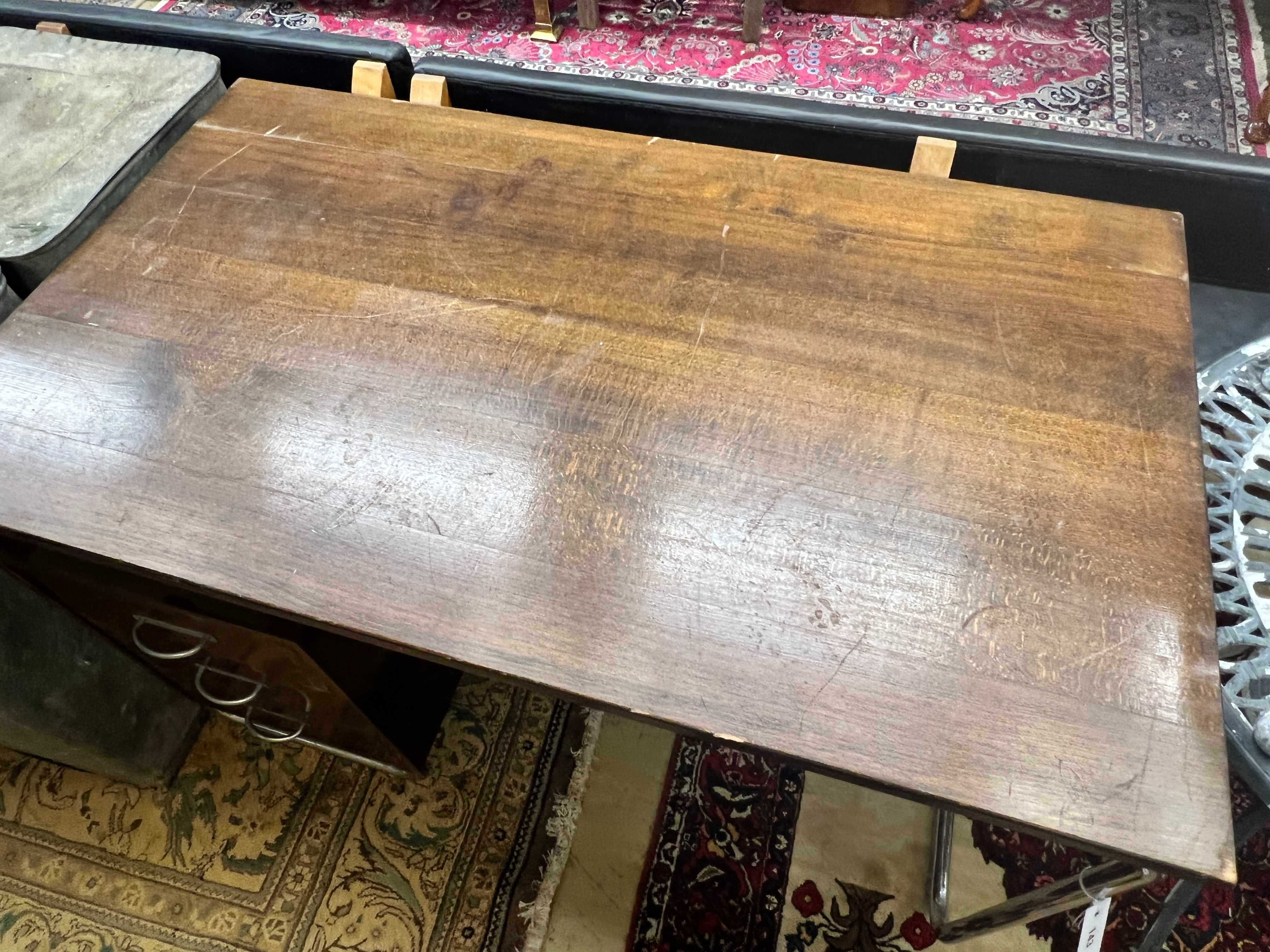 A modernist metal and beech kneehole desk, width 120cm depth 70cm height 75cm